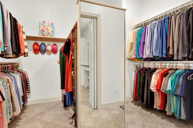 13718 Gainesway Dr, Cypress, TX 77429 - walk in closet with tile patterned flooring