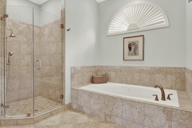 13718 Gainesway Dr, Cypress, TX 77429 - bathroom featuring a bath, a shower stall, and tile patterned flooring