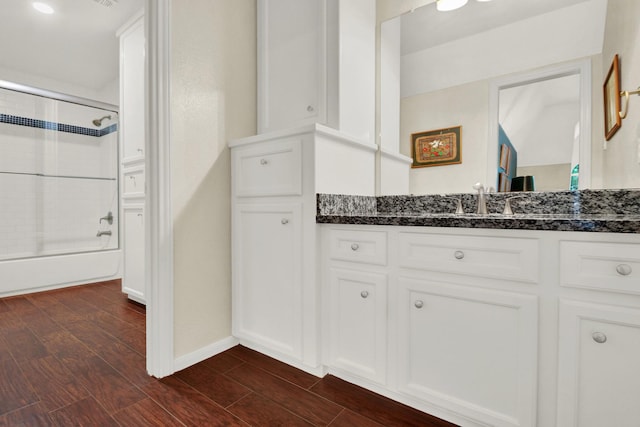 13718 Gainesway Dr, Cypress, TX 77429 - full bath featuring vanity, enclosed tub / shower combo, and wood finished floors