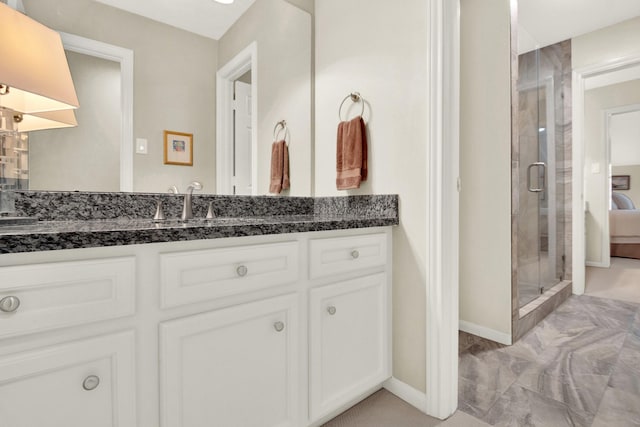13718 Gainesway Dr, Cypress, TX 77429 - bathroom with vanity, a stall shower, and marble look tile flooring