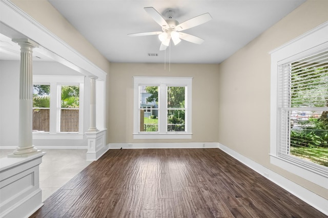 317 11th Ave N, Texas City, TX 77590 - unfurnished living room featuring decorative columns, ceiling fan, and dark wood finished floors