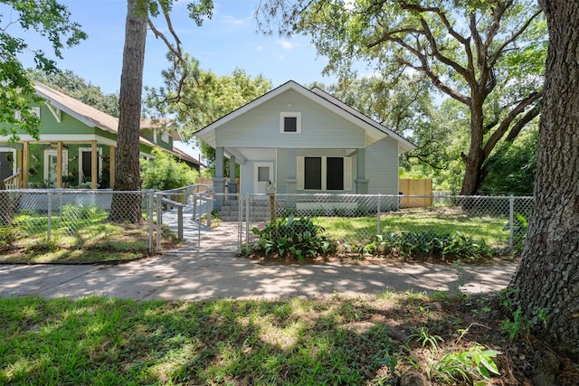 317 11th Ave N, Texas City, TX 77590 - bungalow-style home with a gate, covered porch, and a fenced front yard