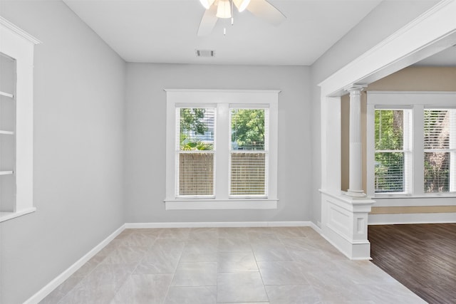 317 11th Ave N, Texas City, TX 77590 - unfurnished room with decorative columns and a ceiling fan