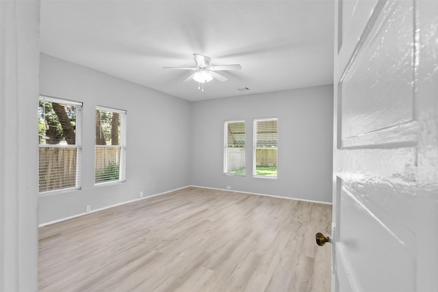 317 11th Ave N, Texas City, TX 77590 - spare room with light wood finished floors and ceiling fan