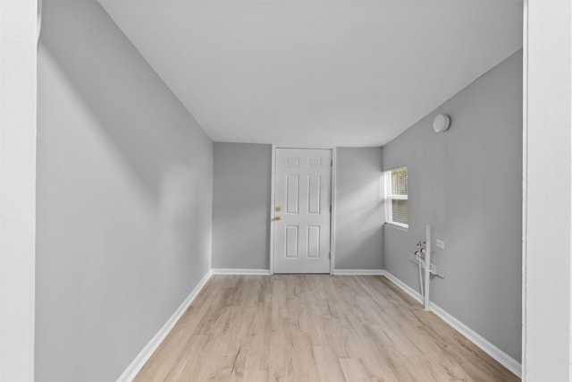 317 11th Ave N, Texas City, TX 77590 - empty room with light wood finished floors and a smoke detector