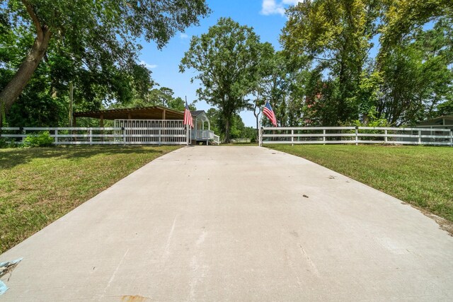 8851 US Highway 59 N, Livingston, TX 77351 - view of concrete driveway featuring a gated entry