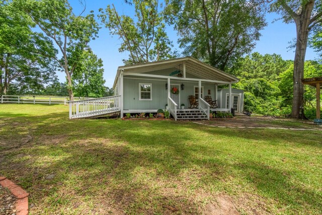 8851 US Highway 59 N, Livingston, TX 77351 - view of front facade featuring covered porch