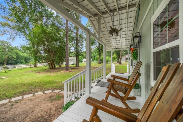 8851 US Highway 59 N, Livingston, TX 77351 - wooden porch featuring a yard