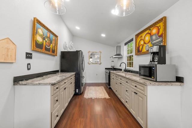 8851 US Highway 59 N, Livingston, TX 77351 - kitchen with stainless steel appliances, dark wood finished floors, wall chimney range hood, lofted ceiling, and light stone countertops