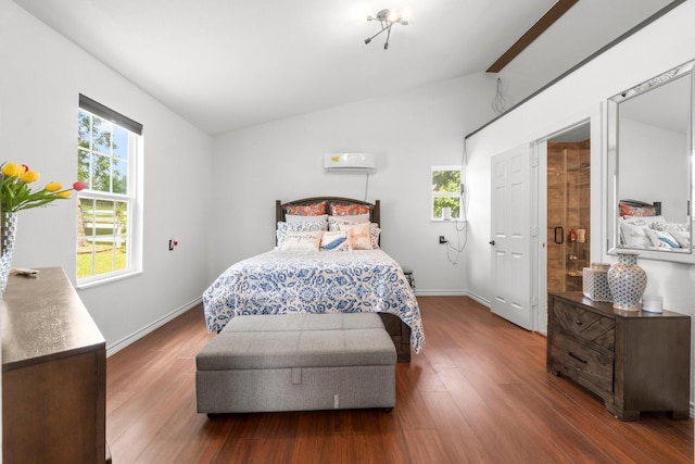 8851 US Highway 59 N, Livingston, TX 77351 - bedroom featuring vaulted ceiling, wood finished floors, and a wall mounted air conditioner