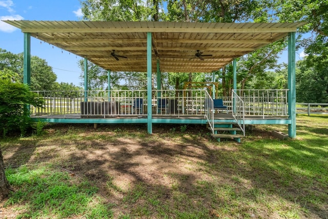 8851 US Highway 59 N, Livingston, TX 77351 - view of yard featuring a ceiling fan and a deck