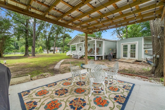 8851 US Highway 59 N, Livingston, TX 77351 - view of patio / terrace featuring french doors and outdoor dining area