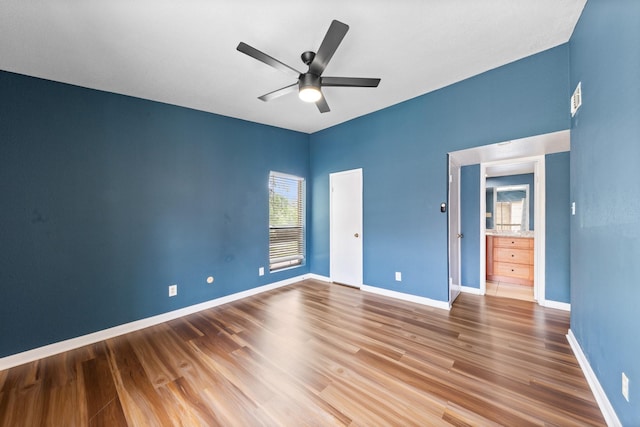 2120 Wilcrest Dr Unit 229, Houston, TX 77042 - unfurnished bedroom featuring wood finished floors and ceiling fan