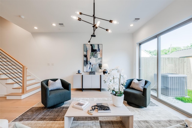 1937 W Clay St, Houston, TX 77019 - living area with wood finished floors, stairs, recessed lighting, and a chandelier