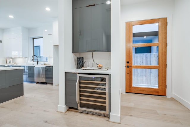 1937 W Clay St, Houston, TX 77019 - indoor dry bar featuring wine cooler, light wood-style flooring, recessed lighting, and dishwasher