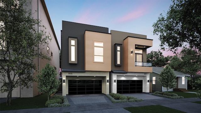 1937 W Clay St, Houston, TX 77019 - contemporary home featuring an attached garage, driveway, and brick siding