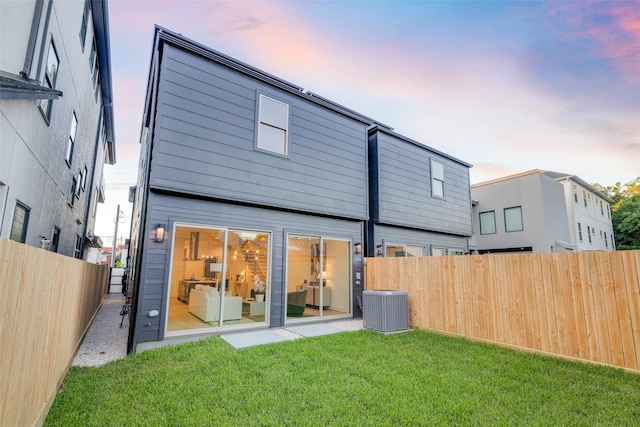 1937 W Clay St, Houston, TX 77019 - back of house at dusk featuring a fenced backyard