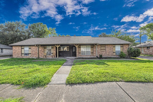 3822 Quiet Place Dr, Houston, TX 77082 - ranch-style home with a front lawn, brick siding, covered porch, and roof with shingles
