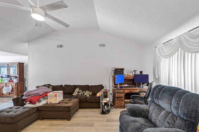 3822 Quiet Place Dr, Houston, TX 77082 - living room with a textured ceiling, light wood-type flooring, vaulted ceiling, an office area, and a ceiling fan