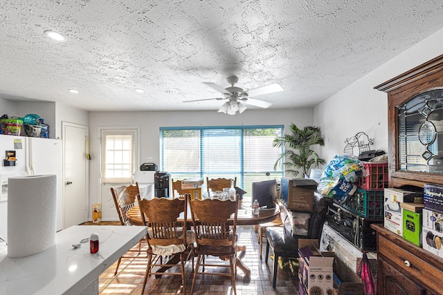 3822 Quiet Place Dr, Houston, TX 77082 - dining room with healthy amount of natural light, ceiling fan, a textured ceiling, and recessed lighting