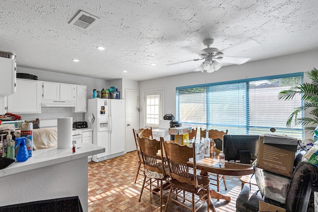 3822 Quiet Place Dr, Houston, TX 77082 - dining space with healthy amount of natural light, a ceiling fan, recessed lighting, and a textured ceiling