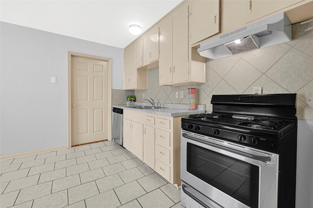 13915 Nitida St, Houston, TX 77045 - kitchen featuring stainless steel appliances, under cabinet range hood, light countertops, decorative backsplash, and light tile patterned flooring