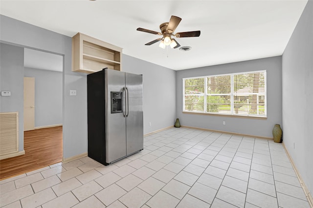 13915 Nitida St, Houston, TX 77045 - kitchen with stainless steel fridge, open shelves, and a ceiling fan