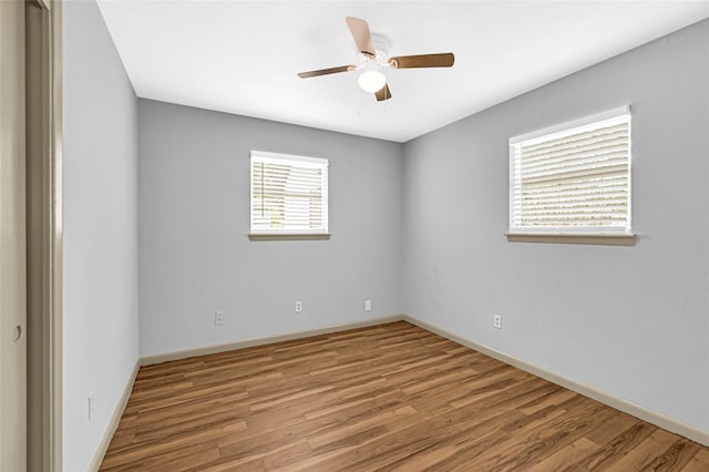 13915 Nitida St, Houston, TX 77045 - empty room with wood finished floors and a ceiling fan