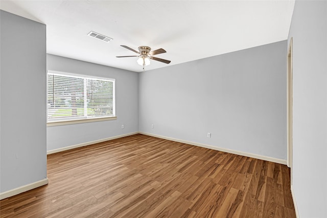 13915 Nitida St, Houston, TX 77045 - spare room with ceiling fan and wood finished floors