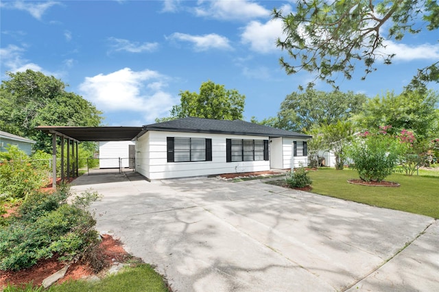 13915 Nitida St, Houston, TX 77045 - single story home with concrete driveway and an attached carport