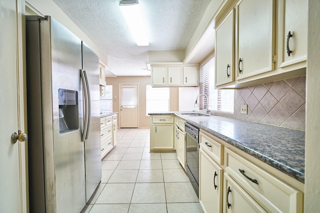 14835 Delbarton Dr, Houston, TX 77083 - kitchen with stainless steel refrigerator with ice dispenser, a textured ceiling, black dishwasher, backsplash, and cream cabinetry