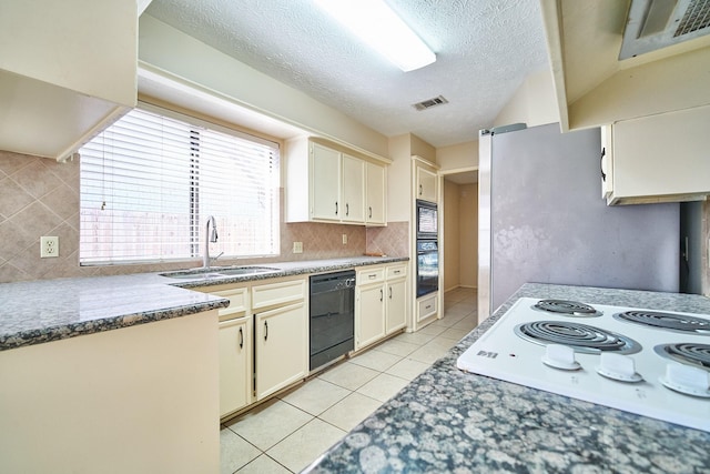 14835 Delbarton Dr, Houston, TX 77083 - kitchen featuring dishwasher, white electric cooktop, light tile patterned flooring, decorative backsplash, and a textured ceiling