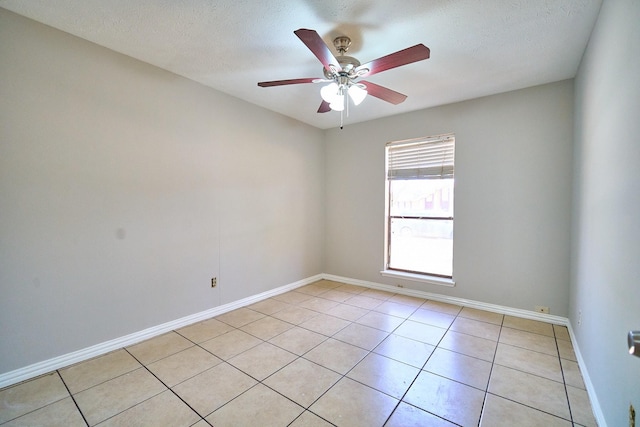 14835 Delbarton Dr, Houston, TX 77083 - unfurnished room featuring ceiling fan, light tile patterned flooring, and a textured ceiling
