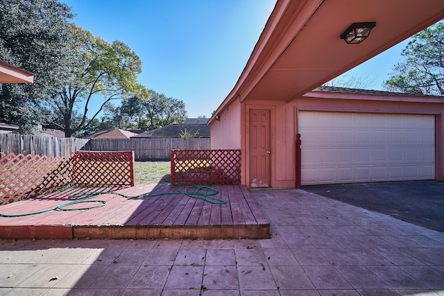 14835 Delbarton Dr, Houston, TX 77083 - wooden terrace with a garage and asphalt driveway
