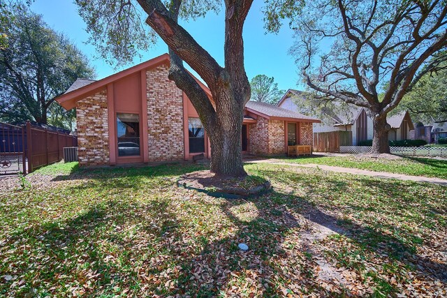 14835 Delbarton Dr, Houston, TX 77083 - mid-century inspired home featuring brick siding