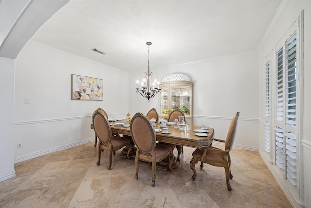 14610 Majestic Oaks, Magnolia, TX 77354 - dining area featuring arched walkways, ornamental molding, and a chandelier