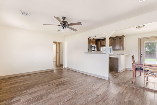 1407 Craig Dr, Galena Park, TX 77547 - unfurnished living room with light wood-style flooring and a ceiling fan
