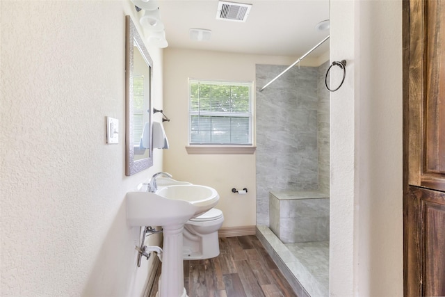 1407 Craig Dr, Galena Park, TX 77547 - full bath featuring a tile shower and wood finished floors