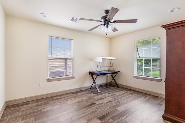 1407 Craig Dr, Galena Park, TX 77547 - unfurnished room featuring wood finished floors, a ceiling fan, and recessed lighting