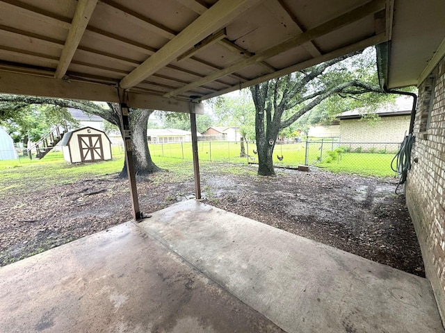 1722 Briar Ln, Wharton, TX 77488 - view of patio featuring a storage shed