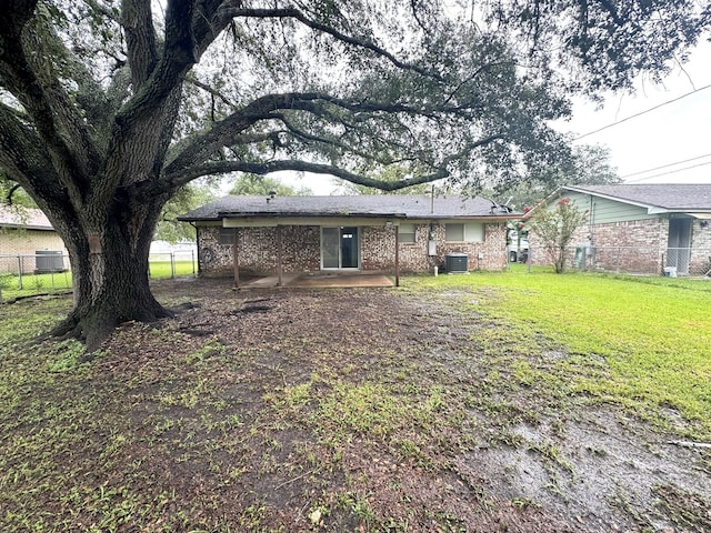 1722 Briar Ln, Wharton, TX 77488 - back of house featuring a patio and brick siding
