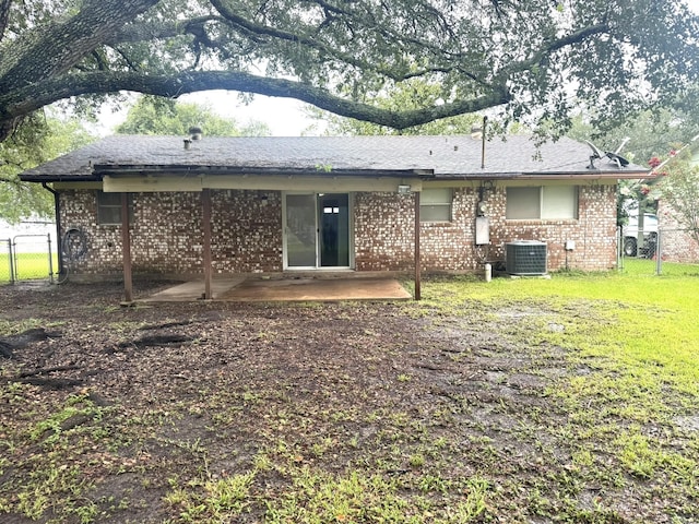 1722 Briar Ln, Wharton, TX 77488 - rear view of house featuring a patio area, a gate, and brick siding