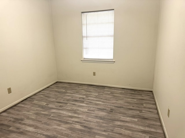 1722 Briar Ln, Wharton, TX 77488 - spare room with baseboards and wood finished floors