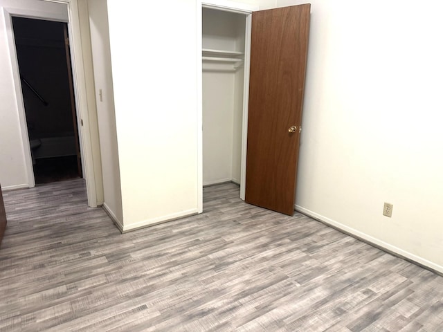 1722 Briar Ln, Wharton, TX 77488 - unfurnished bedroom with a closet and wood finished floors