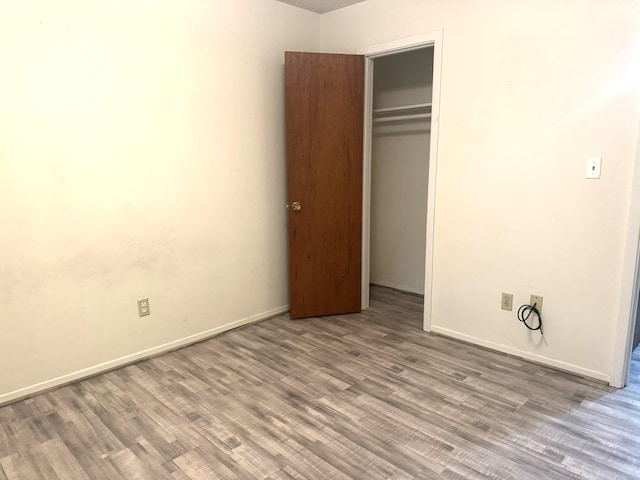 1722 Briar Ln, Wharton, TX 77488 - unfurnished bedroom featuring a closet and wood finished floors