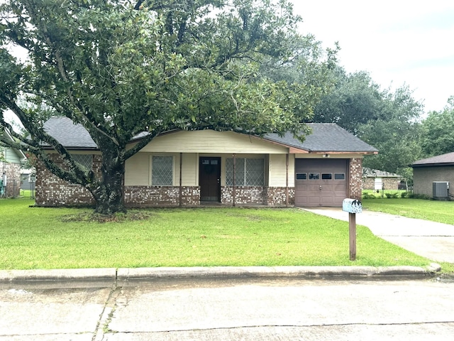 1722 Briar Ln, Wharton, TX 77488 - view of front of house featuring concrete driveway, a garage, brick siding, covered porch, and a front yard