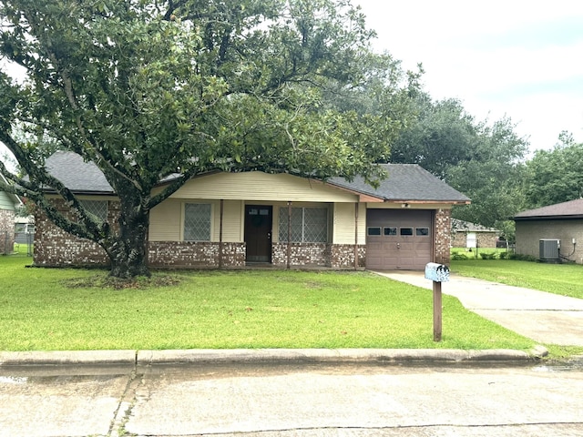 1722 Briar Ln, Wharton, TX 77488 - view of front facade featuring brick siding, driveway, an attached garage, a porch, and a front lawn