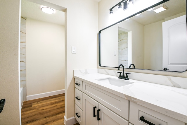 6303 Tamar Dr, Pasadena, TX 77503 - bathroom with vanity, wood finished floors, a bathtub, and a shower
