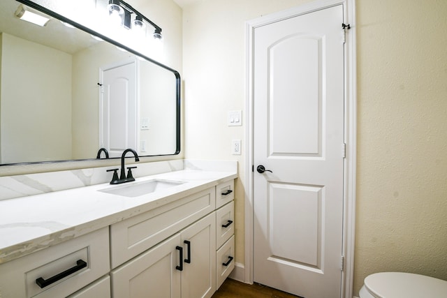 6303 Tamar Dr, Pasadena, TX 77503 - bathroom with vanity and toilet
