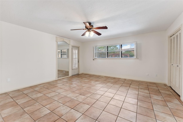 3435 Anderson Rd, Baytown, TX 77521 - unfurnished room featuring a ceiling fan and light tile patterned floors